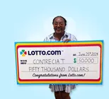Winner Contrecia T. holds a check for $50,000 in her hands